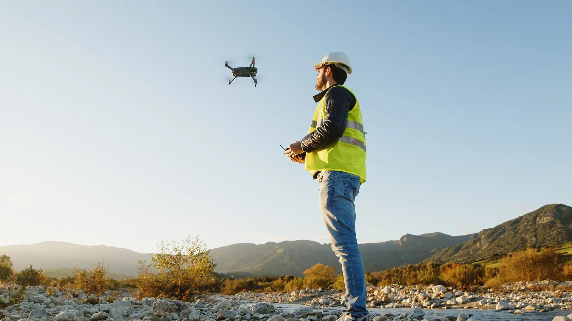 Flying a drone in a hi-vis jacket.