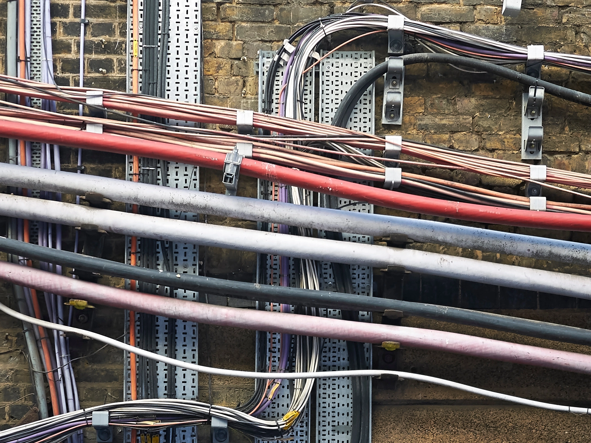 Network of wires and cables underground.