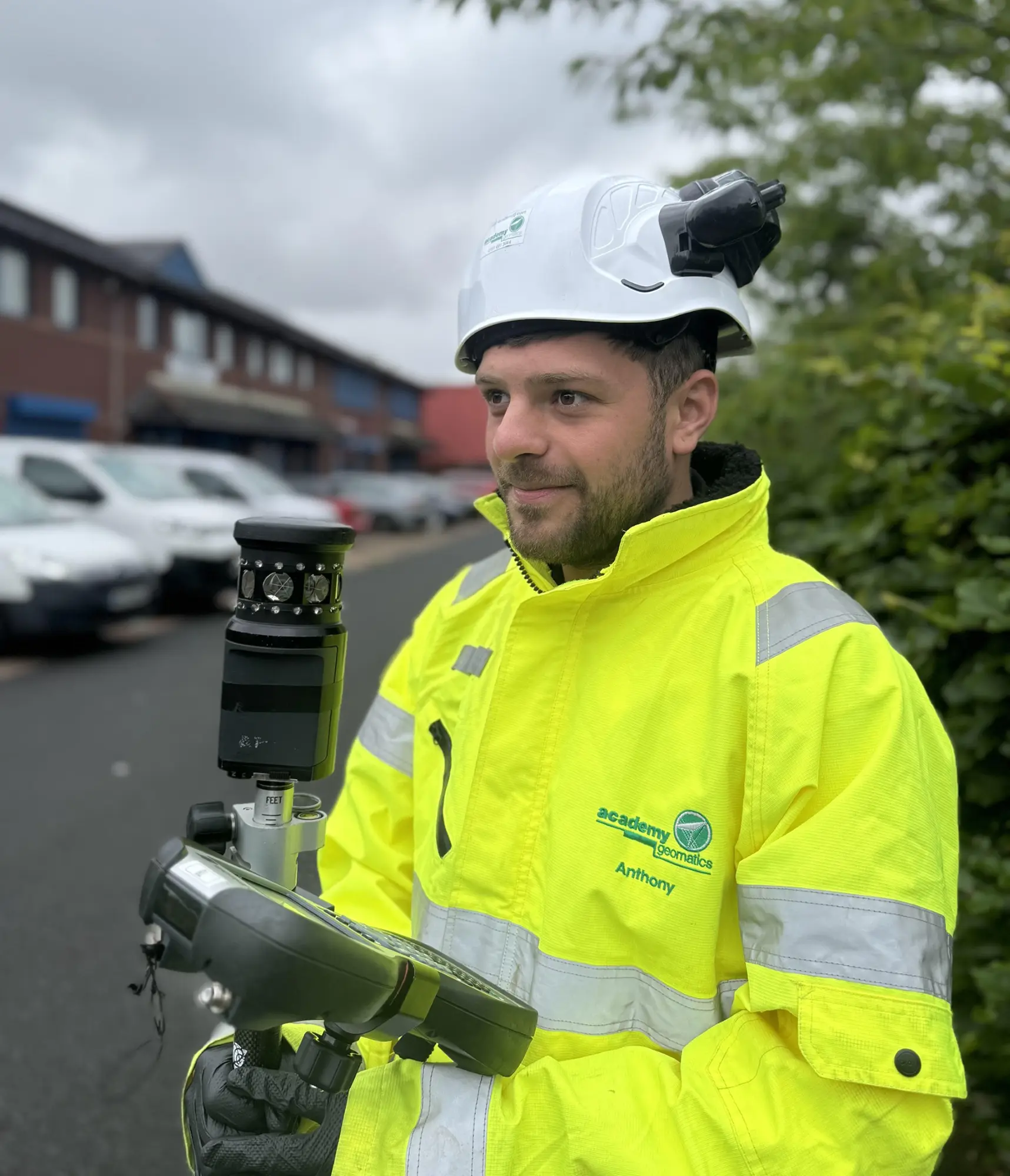 An Academy Geomatics worker carrying out a survey