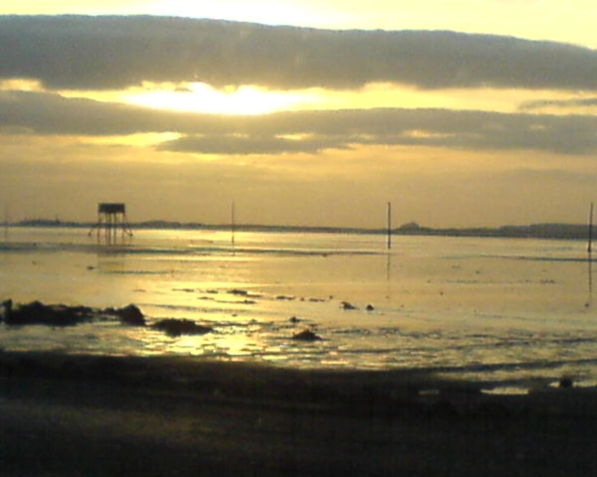 Yellow light bathing the sea off the North East coast.