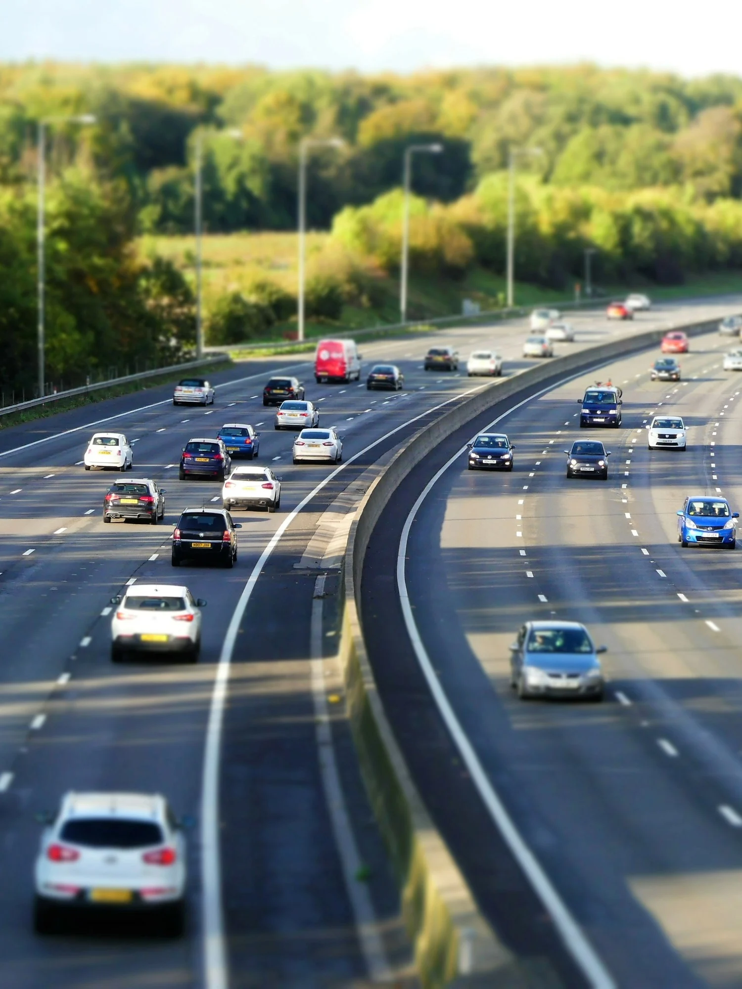A busy British motorway with traffic flowing in both directions.