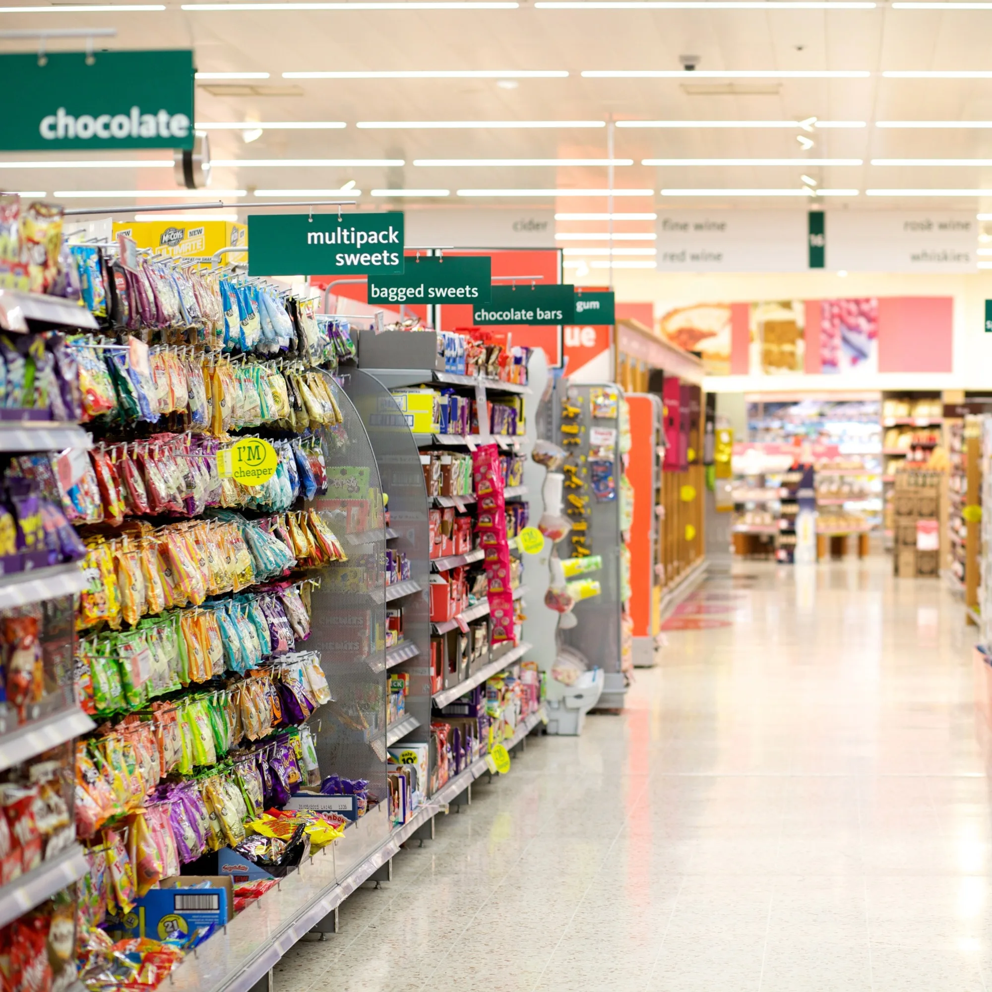 A British supermarket aisle with snacks.